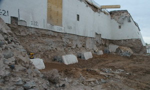 contrapared stripped, showing wall deterioration underneath, during the restoration of Isleta Pueblo St. Augustine church