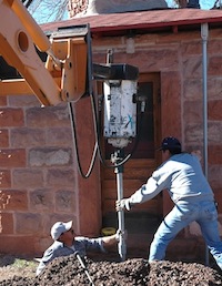 installing helical piers at Hubbell Trading Post guest hogan